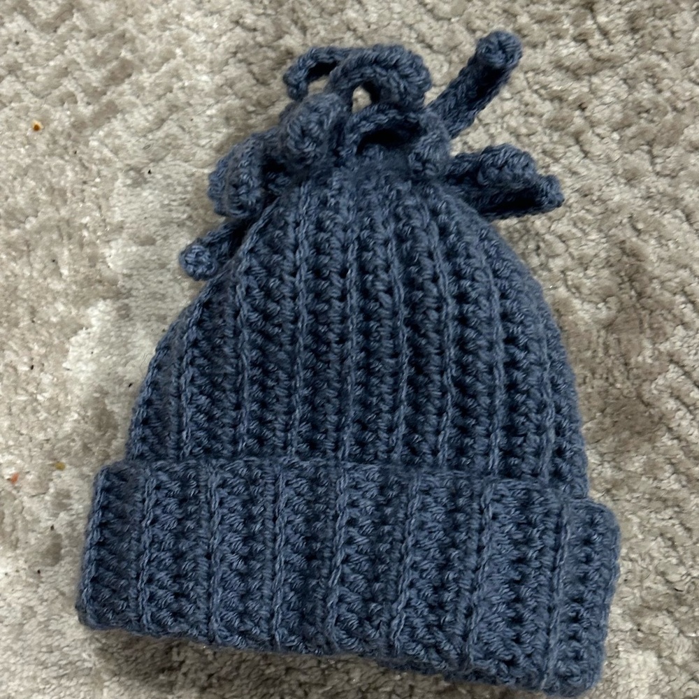 Hand crocheted fun fringe beanie, fits size 6-9 months. 100% acrylic yarn, NEW